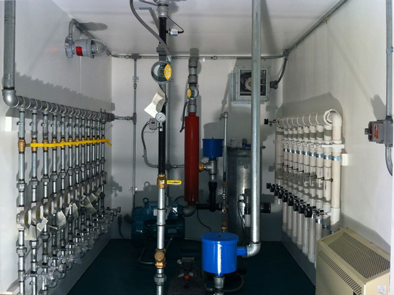 Soil vapor extraction system with thermal/catalytic oxidizer for fume destruction, air sparging, and Operator Control System (OCS) touch screen and display.